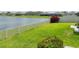 Landscaped backyard with water view at 5474 Leslie Canyon Dr, Wimauma, FL 33598
