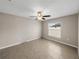 Spacious bedroom with ceiling fan and tile flooring at 5474 Leslie Canyon Dr, Wimauma, FL 33598
