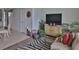Living room features a comfortable sofa, decorative rug, and built-in entertainment center at 549 Bahia Beach Blvd, Ruskin, FL 33570