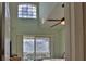 Main bedroom with high ceilings, large window and access to balcony at 549 Bahia Beach Blvd, Ruskin, FL 33570