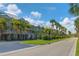 Attractive community with tropical landscaping and charming two-story buildings at 549 Bahia Beach Blvd, Ruskin, FL 33570