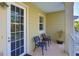 Private balcony with two chairs and a small plant at 549 Bahia Beach Blvd, Ruskin, FL 33570
