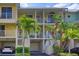 Two-story building with balconies, garages, and tropical landscaping at 549 Bahia Beach Blvd, Ruskin, FL 33570