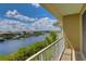 Balcony overlooking a peaceful waterway with boats and waterfront homes at 549 Bahia Beach Blvd, Ruskin, FL 33570