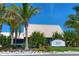 Building exterior showcasing landscaping and signage for Sunset Bar & Grill at 549 Bahia Beach Blvd, Ruskin, FL 33570