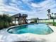 Stunning pool area overlooking a tranquil riverfront setting at 9408 Oak St, Riverview, FL 33578