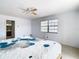 Bright bedroom with a large bed and ensuite bathroom access at 9408 Oak St, Riverview, FL 33578
