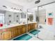 Spacious bathroom with dual sinks and a shower/tub combo at 9408 Oak St, Riverview, FL 33578