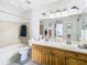 Clean bathroom with dual sinks and a shower/tub combo at 9408 Oak St, Riverview, FL 33578