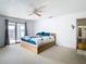 Main bedroom with private balcony and water views at 9408 Oak St, Riverview, FL 33578