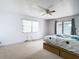 Bedroom with window, ceiling fan, and carpeted floor at 9408 Oak St, Riverview, FL 33578