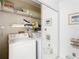 Laundry room with washer, dryer, and shelving at 9408 Oak St, Riverview, FL 33578
