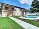 Back exterior view, two story home with pool at 9408 Oak St, Riverview, FL 33578