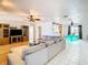 Open living room and dining area with hardwood and tile floors, neutral color palette at 9408 Oak St, Riverview, FL 33578