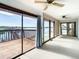 Spacious living room featuring water views and access to deck at 9408 Oak St, Riverview, FL 33578