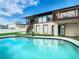 Two-story home with a large, inviting pool and patio area at 9408 Oak St, Riverview, FL 33578