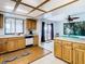 Kitchen features wood cabinets, tile floors, and a view to backyard at 9408 Oak St, Riverview, FL 33578