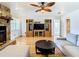Living room with stone fireplace, built-in shelving, and comfy sofas at 9408 Oak St, Riverview, FL 33578