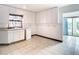 Bright laundry room with cabinets and access to the pool at 9408 Oak St, Riverview, FL 33578