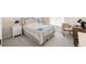 Cozy bedroom with a comfortable bed and built-in workspace at 35506 Wickingham Ct, Zephyrhills, FL 33541