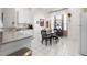 Kitchen with breakfast nook and white cabinets at 35506 Wickingham Ct, Zephyrhills, FL 33541