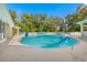 Inviting community pool with lounge chairs and umbrellas at 35506 Wickingham Ct, Zephyrhills, FL 33541