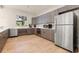 Community kitchen with modern appliances and cabinetry at 35506 Wickingham Ct, Zephyrhills, FL 33541