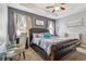 Spacious main bedroom with plush bed and seating area at 10012 Sage Creek Dr, Ruskin, FL 33573