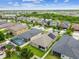 Aerial view of a house with solar panels, a pool, and a playground at 10012 Sage Creek Dr, Ruskin, FL 33573