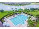 Community lap pool with plenty of lounge chairs at 10012 Sage Creek Dr, Ruskin, FL 33573