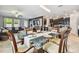 Open concept dining room with a view into the living room and kitchen at 10012 Sage Creek Dr, Ruskin, FL 33573