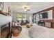Open concept living room with fireplace and large sectional sofa at 10012 Sage Creek Dr, Ruskin, FL 33573