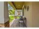 Relaxing front porch with wicker seating and a view of the neighborhood at 10012 Sage Creek Dr, Ruskin, FL 33573