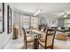 Dining room with a glass-top table and seating for six at 10012 Sage Creek Dr, Ruskin, FL 33573