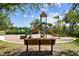 Modern playground with a shaded bench at 10012 Sage Creek Dr, Ruskin, FL 33573
