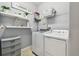 Laundry room with washer, dryer, and shelving at 10012 Sage Creek Dr, Ruskin, FL 33573