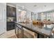Kitchen island with granite countertop and stainless steel sink at 10012 Sage Creek Dr, Ruskin, FL 33573