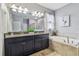 Bathroom boasts double vanity, soaking tub, and shower at 10012 Sage Creek Dr, Ruskin, FL 33573