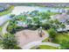 Community playground with swings and slides near a lake at 10012 Sage Creek Dr, Ruskin, FL 33573