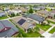 Aerial view of a house with solar panels in a residential neighborhood at 10012 Sage Creek Dr, Ruskin, FL 33573