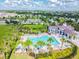 Community pool with cabana and surrounding lounge chairs at 10012 Sage Creek Dr, Ruskin, FL 33573