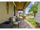 Inviting front porch with wicker chairs and brick pavers at 10012 Sage Creek Dr, Ruskin, FL 33573
