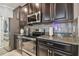 Well-equipped kitchen with stainless steel appliances and granite countertops at 10012 Sage Creek Dr, Ruskin, FL 33573