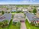 Aerial view of a house with solar panels and a landscaped yard at 10012 Sage Creek Dr, Ruskin, FL 33573