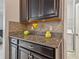 Kitchen features dark wood cabinets and granite countertops at 10012 Sage Creek Dr, Ruskin, FL 33573
