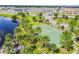 Community basketball court with palm trees and lake view at 10012 Sage Creek Dr, Ruskin, FL 33573