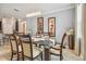 Elegant dining room with a dark wood table, seating for six, and stylish wall art at 10012 Sage Creek Dr, Ruskin, FL 33573