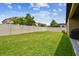 Spacious backyard with a large grassy area and privacy fence at 10012 Sage Creek Dr, Ruskin, FL 33573
