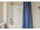 Bathroom with shower/tub combo and blue wave curtain at 10012 Sage Creek Dr, Ruskin, FL 33573