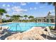 Relaxing community pool with lounge chairs at 10012 Sage Creek Dr, Ruskin, FL 33573